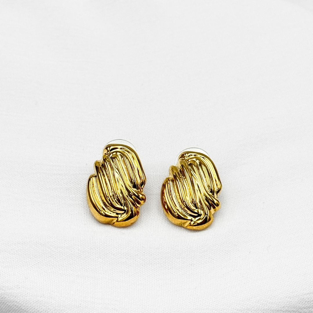 ARETES ESCULTURALES DE DISEÑO FLUIDO CON TEXTURA ACANALADA EN ACERO  AR3176G30