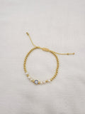 Pulsera de Ojo Turco con Perlas y bolitas doradas en acero bañado en oro de 18K  PU2061G47