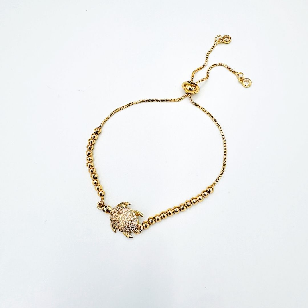 PULSERA CON DIJE DE TORTUGA EN BAÑO DE ORO Y CIRCONES PU2112G47